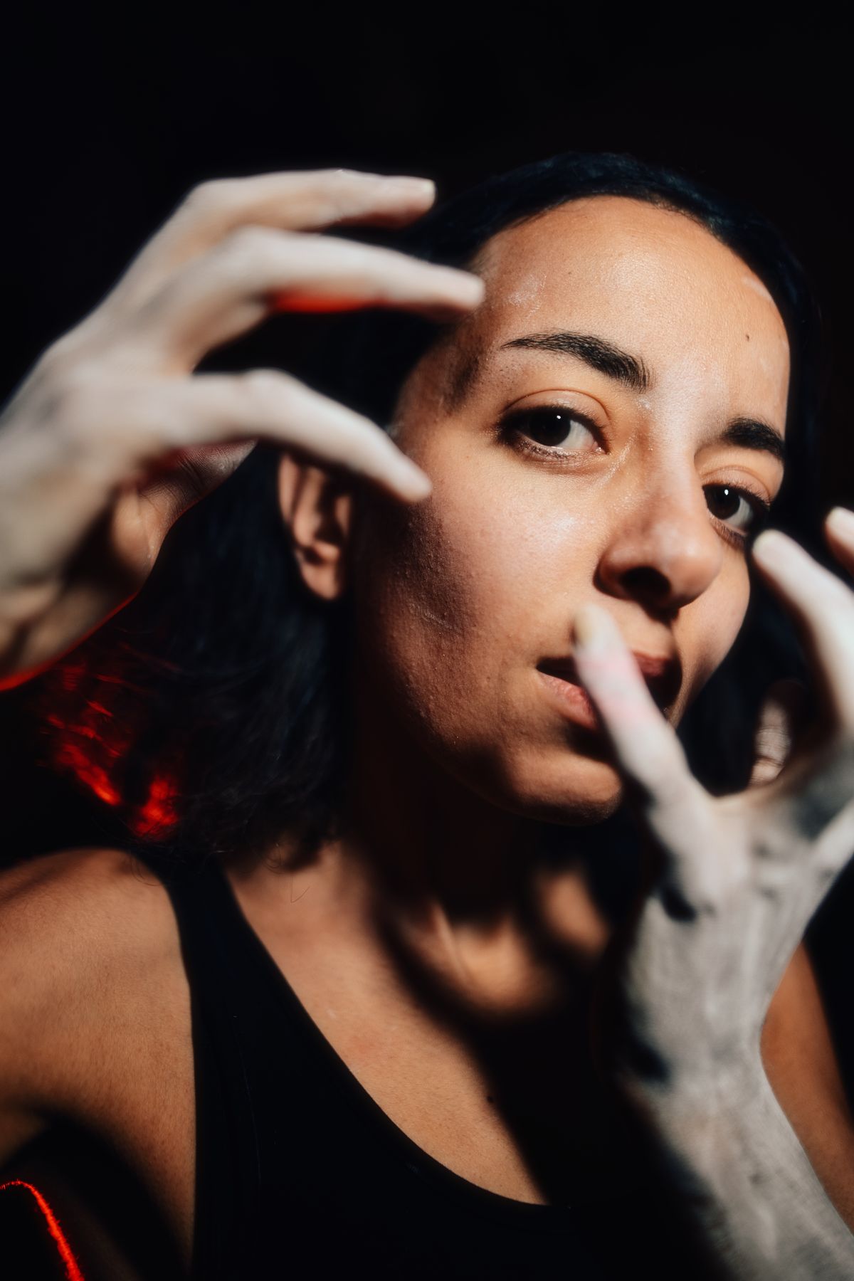 Expressive portrait with powdered hands